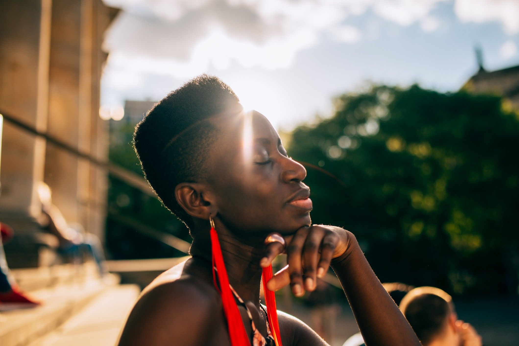 Black-woman-basking-in-light-of-the-sun-letting-go